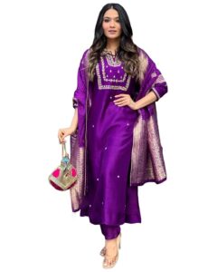 "Women wearing a royal purple silk kurta set with embroidered detailing and golden Banarasi dupatta,